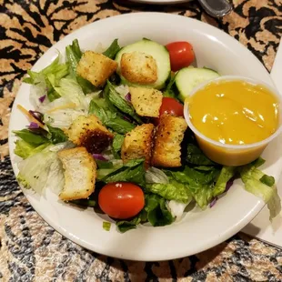 Dinner salad with huge croutons and honey mustard dressing.