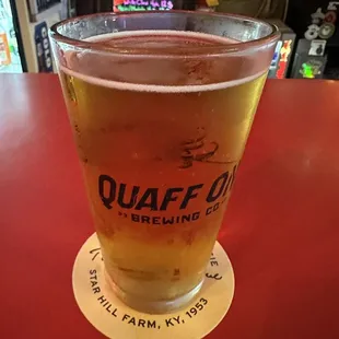 a pint of quaff on a red table
