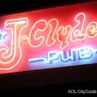 a neon sign for a pub