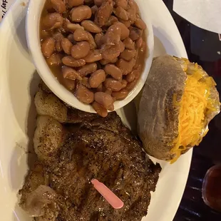 10 oz ribeye with pinto beans and baked potato.