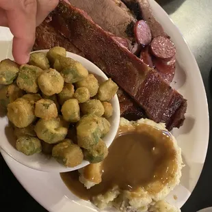 3 meat plate with fried okra and mashed potatoes