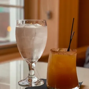 a drink and a drink glass on a table