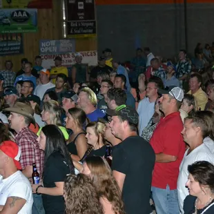  a large crowd of people at a convention