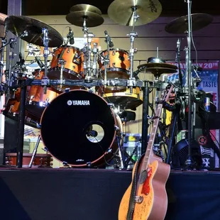  a man playing a guitar on stage