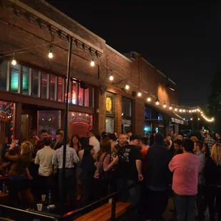  a crowd of people outside a restaurant