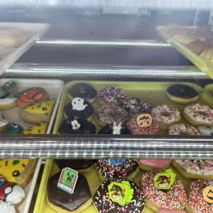a variety of doughnuts in a display case