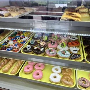 a variety of doughnuts in a display case