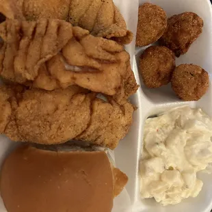 Dinner Combo #1 with five pieces of fish (snapper) hush puppies and potato salad. You may chose a different fish but I like snapper.