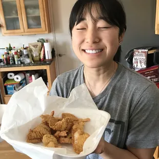 My sister enjoying some fried fish y&apos;all!