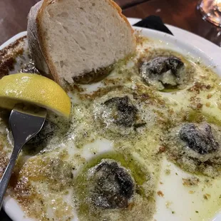 Escargot with sopping bread and garlic butter