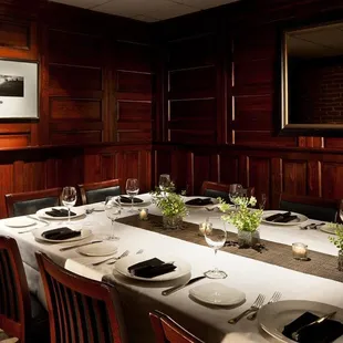 a long table set with place settings