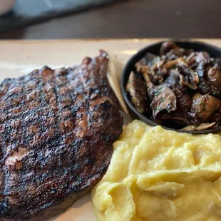 Bone-in ribeye, Yukon mashed potatoes and wild mushrooms with truffle butter
