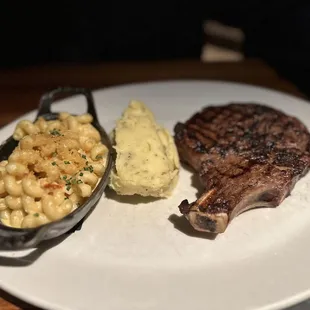 Cowboy cut ribeye mashed potatoes and lobster Mac and cheese