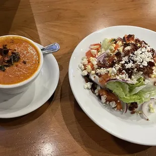 Cup of tomato basil soup and wedge salad