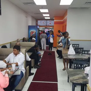 a group of people eating in a restaurant