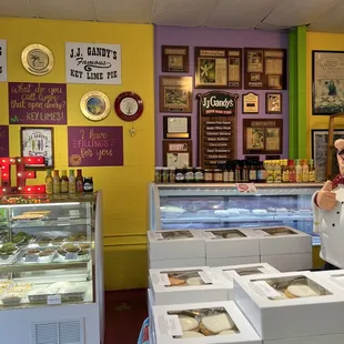 a woman standing in front of the counter