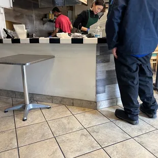 a man standing at the counter