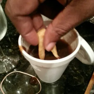 Dunking them in brown gravy...so yummy!