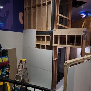 Installing drywall on elevator we are building for Chuck E. Cheese in San Jose.