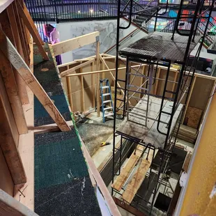 Scaffolding installed in elevator pit we built to start building the elevator shaft for Chuck E. Cheese in San Jose.