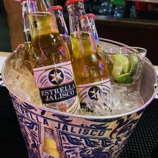 two bottles of beer in a bucket