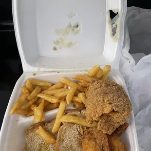 chicken and fries in a styrofoam container