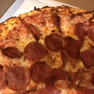a pepperoni pizza in a box