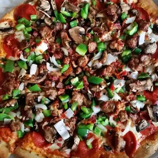 Thin crust Deluxe pizza, with bacon. So much fresher and better than chain pizza.