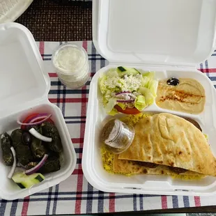 Flaffel plate and half dolma. Came with three sauce sides which was very tasty