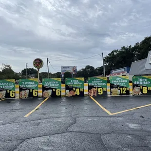  row of delivery trucks in a parking lot