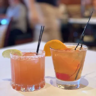 two cocktails on a table