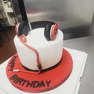 a birthday cake with headphones