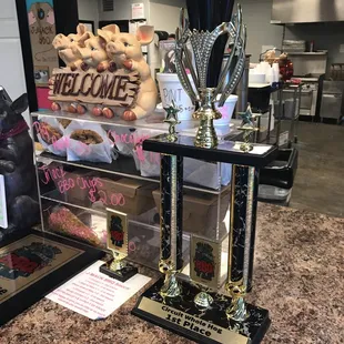 a trophy and a sign on the counter