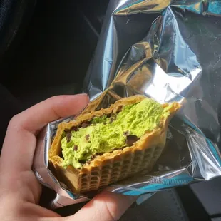 A green tea ice cream sandwich! It had ice cream cone around it instead of those soft cookies. Delicious, and only $1.89