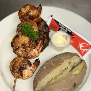Filet with grilled blackened shrimp and a baked potato
