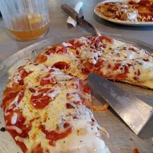 Fire roasted pizza with bacon, pepperoni and extra cheese