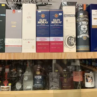 a shelf full of liquor