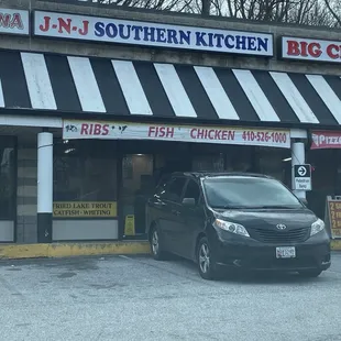 ows a car parked in front of the restaurant