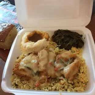 Smothered chicken over rice with greens and mashed potatoes and gravy! Pretty tasty.