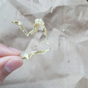 ws a hand holding a piece of paper