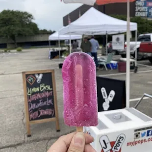 a pink ice cream on a stick