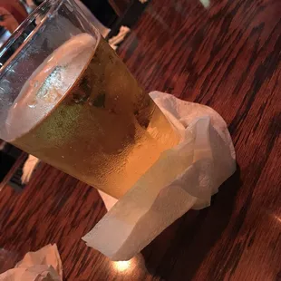 a glass of beer on a table