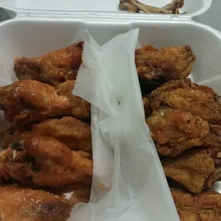 Amazing flavors(lemon pepper on the right, hot honey on the left)...amazingly small wings.