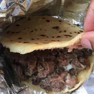 Piping hot Gordita with fajita, cheese and beans