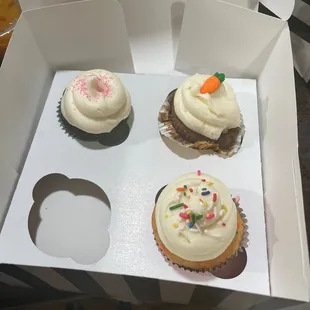 three cupcakes in a box
