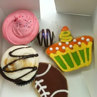 Strawberry cupcake, Snickers cupcake, chocolate cake pop, &amp; 2 sugar cookies. Not pictured: vanilla cake pop already in mah belly