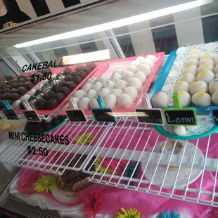 a display case filled with different types of cupcakes