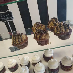 a display of cupcakes and muffins