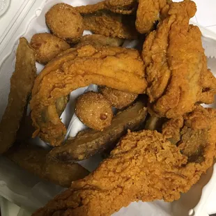 Fried trout lunch special with western fries and hush puppies. Delicious and seasoned to perfection.