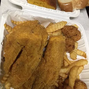 Lunch special- tilapia with fries and hush puppies. Tilapia needed a little more seasoning. For me.